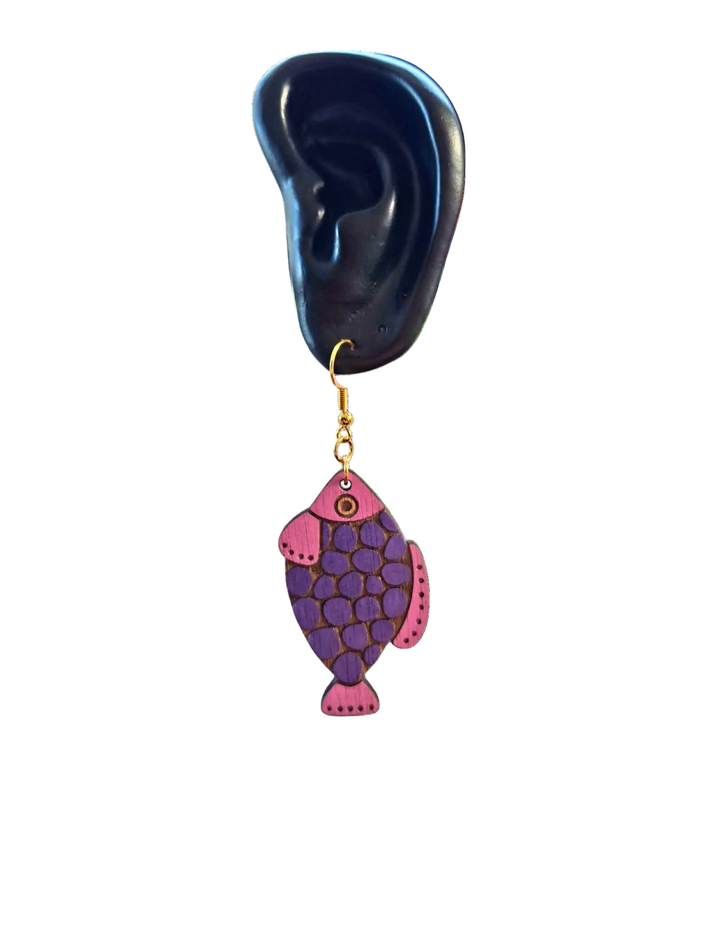 Purple and pink fish-shaped earring on a white background